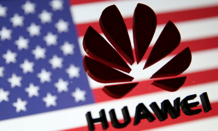 FILE PHOTO: A 3D printed Huawei logo is placed on glass above displayed US flag in this illustration